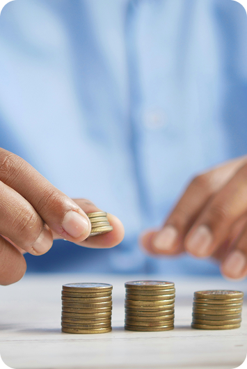 Person stacking coins, representing lending industry growth